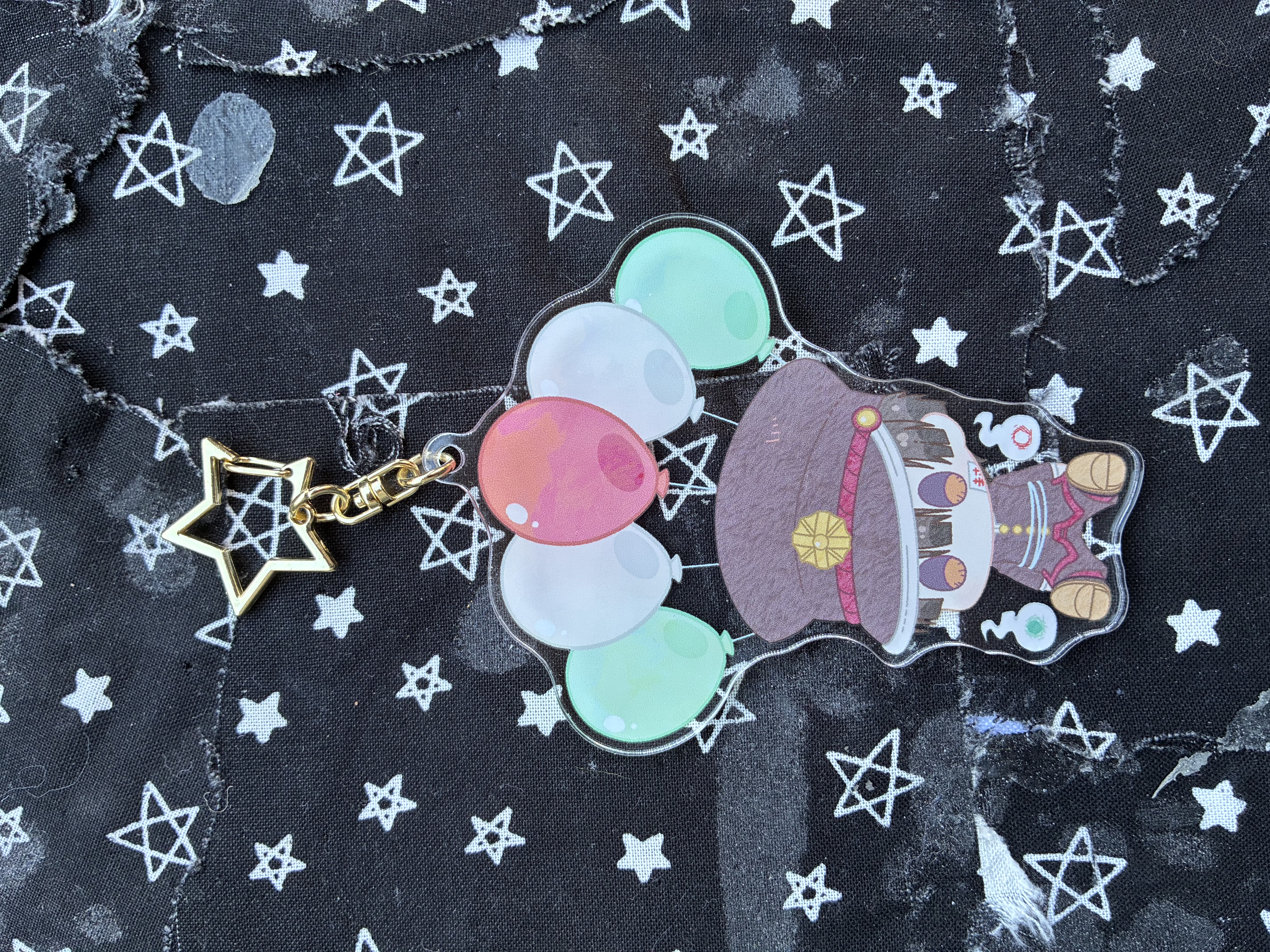 Acrylic charm of Jibaku shounen hanako kun Hanako wrapped in balloons surrounded by the hakujoudai.